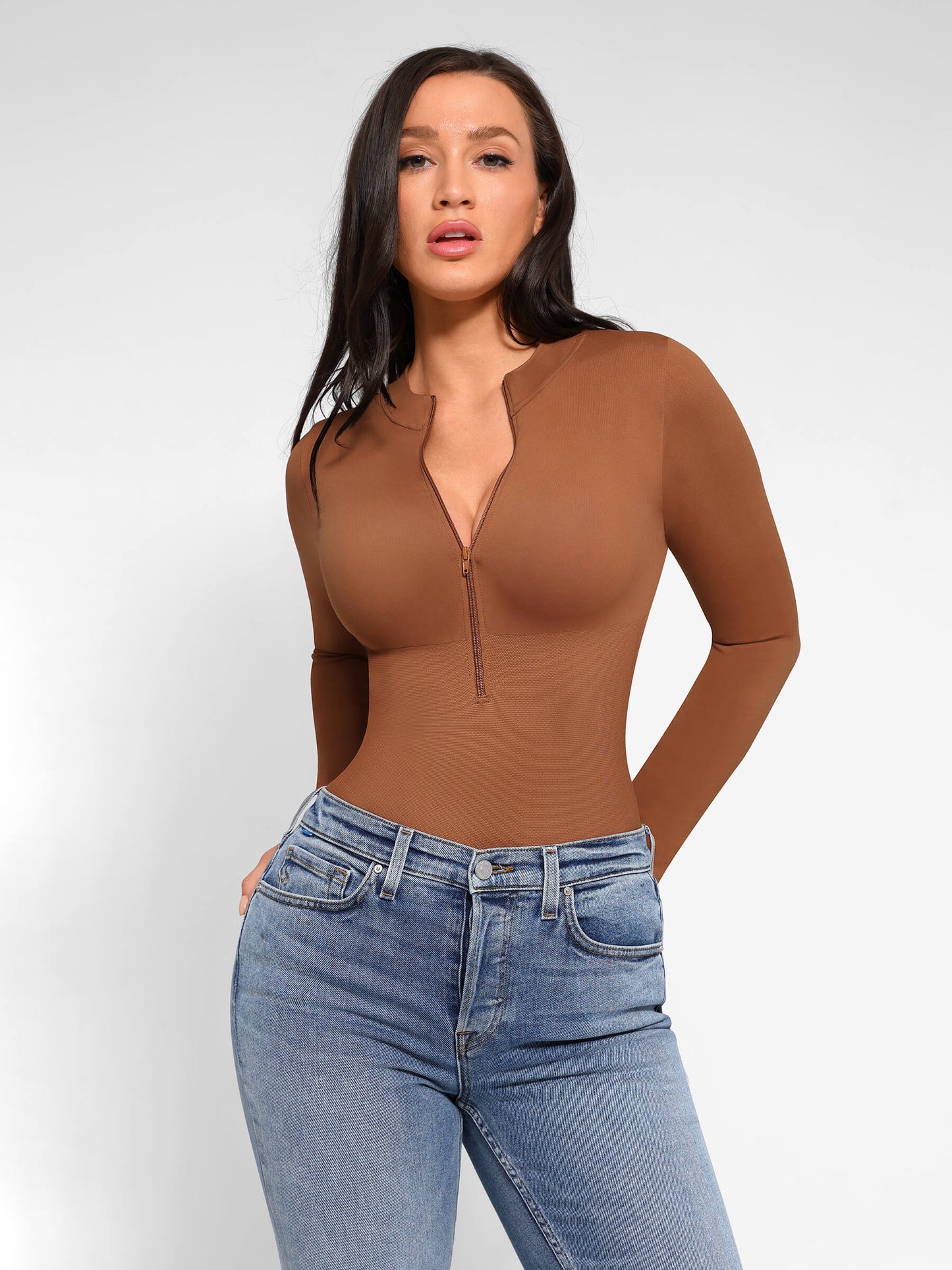 https://cdn.shopify.com/s/files/1/0089/1846/6641/files/FeelinGirl_Seamless_Long_Sleeve_Zipper_Thong_Bodysuit_18.jpg?v=1765451284