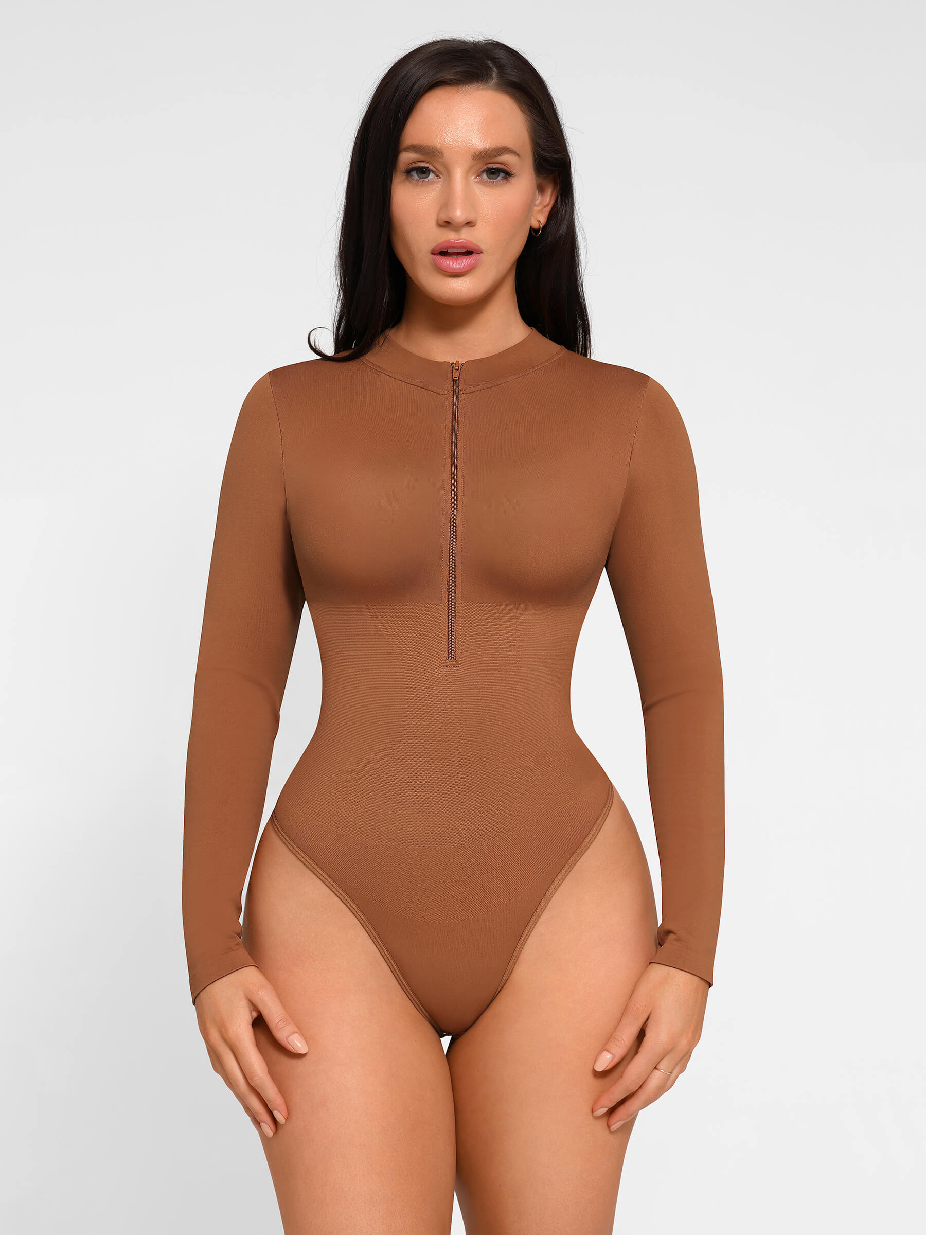 https://cdn.shopify.com/s/files/1/0089/1846/6641/files/FeelinGirl_Seamless_Long_Sleeve_Zipper_Thong_Bodysuit_6.jpg?v=1765451284