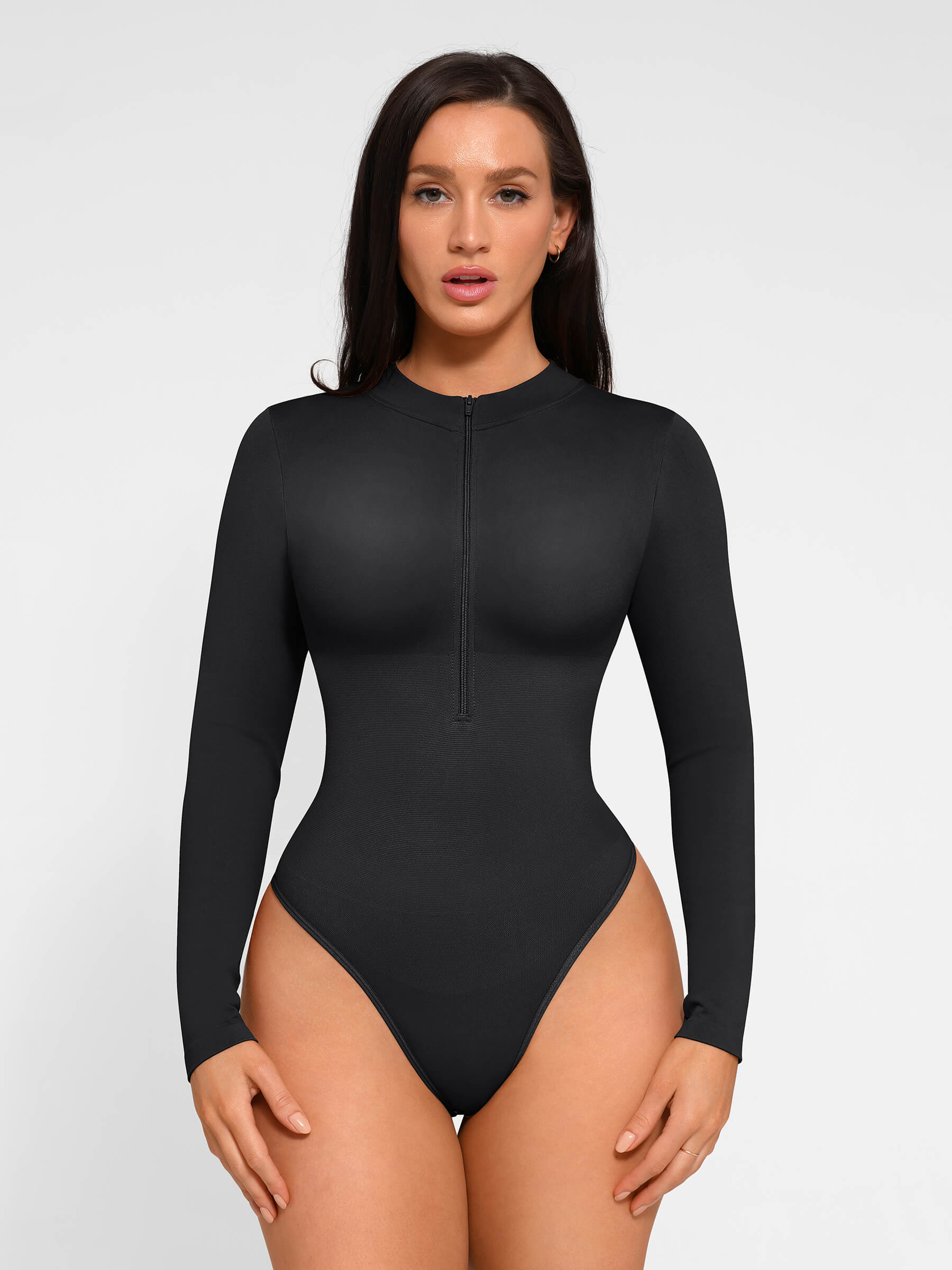 https://cdn.shopify.com/s/files/1/0089/1846/6641/files/FeelinGirl_Seamless_Long_Sleeve_Zipper_Thong_Bodysuit_8.jpg?v=1765451284